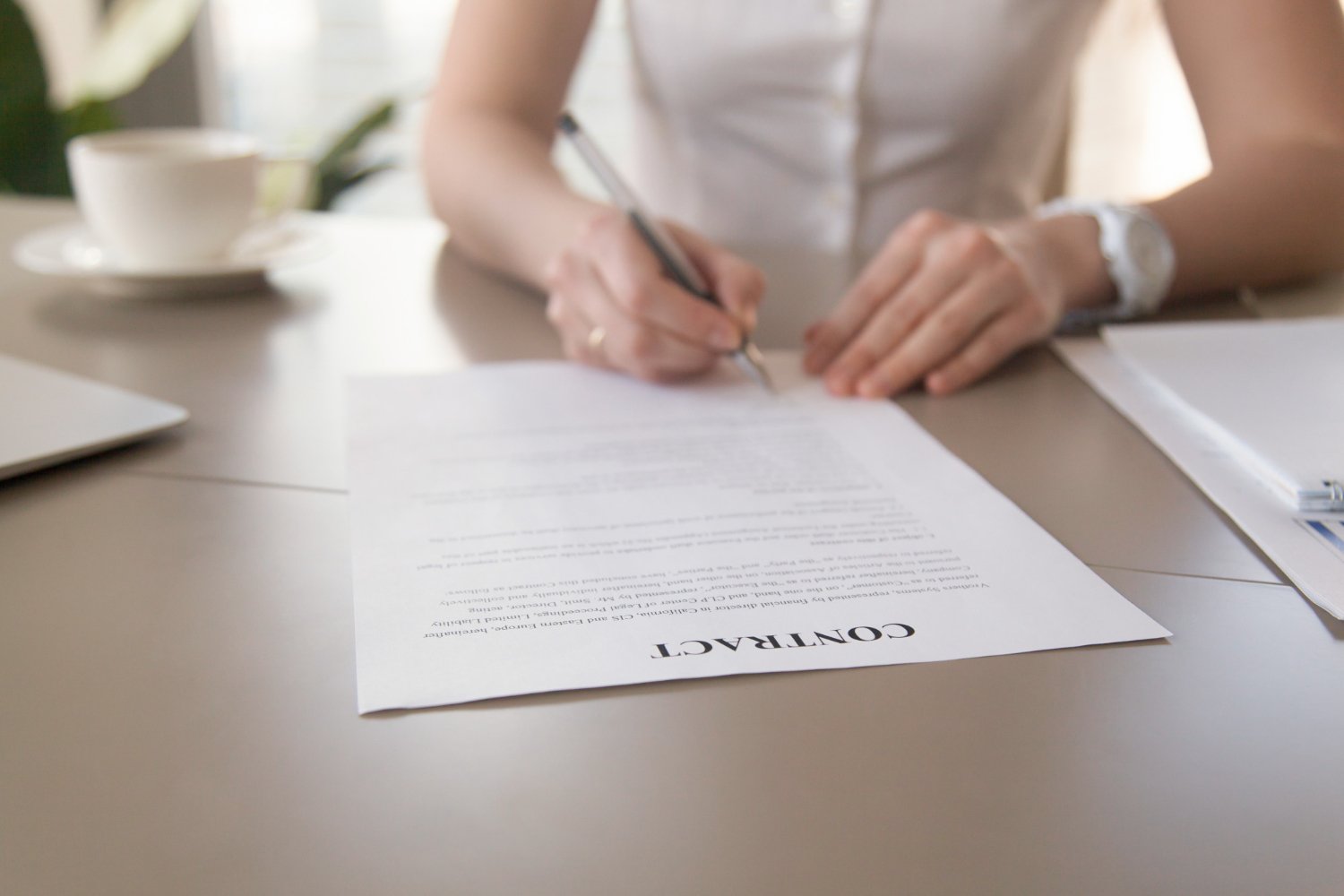 Business woman signing document